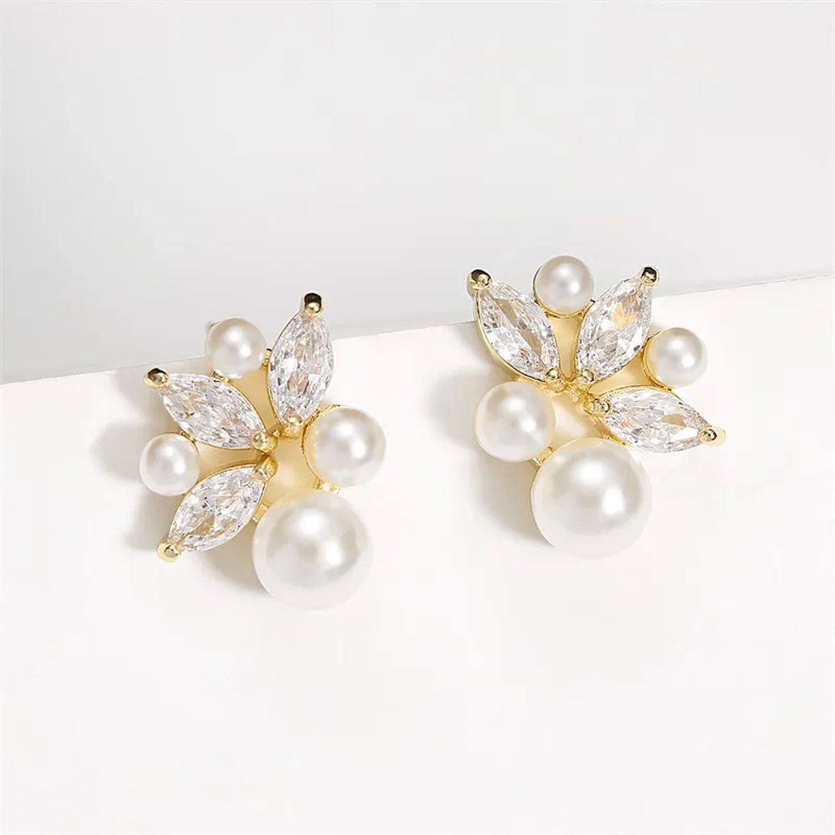 Elegant Imitation Pearl Earrings with Shiny Zircon and Leaf Design