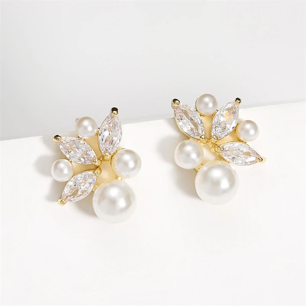 Elegant Imitation Pearl Earrings with Shiny Zircon and Leaf Design