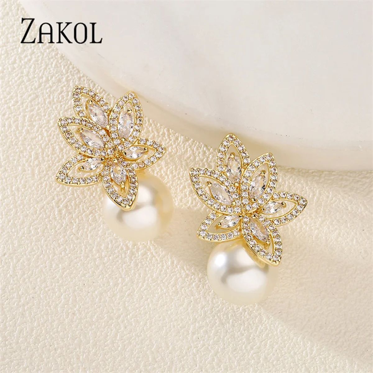 Elegant Simulated Pearl Stud Earrings with Cubic Zirconia Detailing Elegant Simulated Pearl Stud Earrings with Cubic Zirconia Detailing