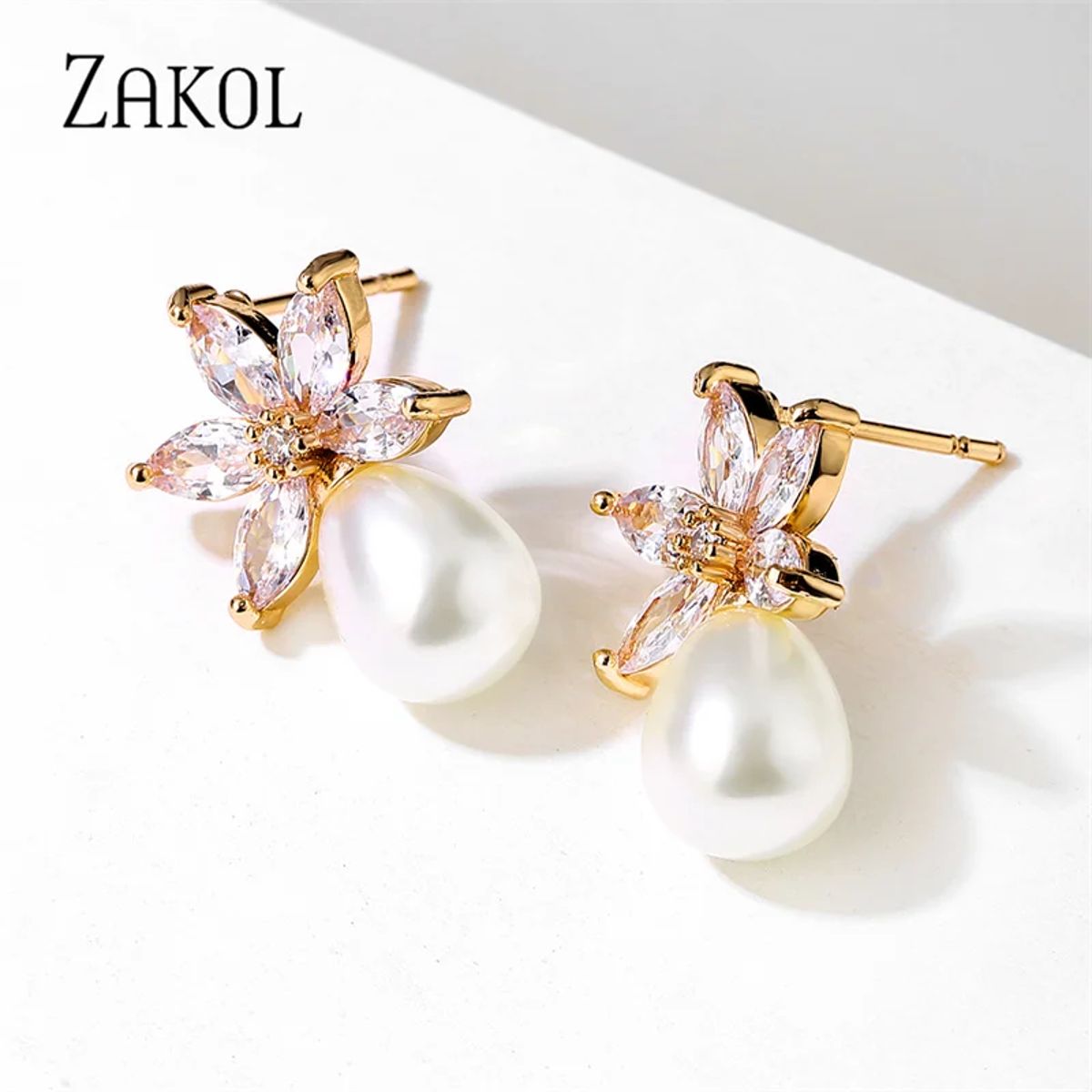 Elegant Leaf-Shaped Cubic Zirconia and Pearl Drop Earrings Elegant Leaf-Shaped Cubic Zirconia and Pearl Drop Earrings