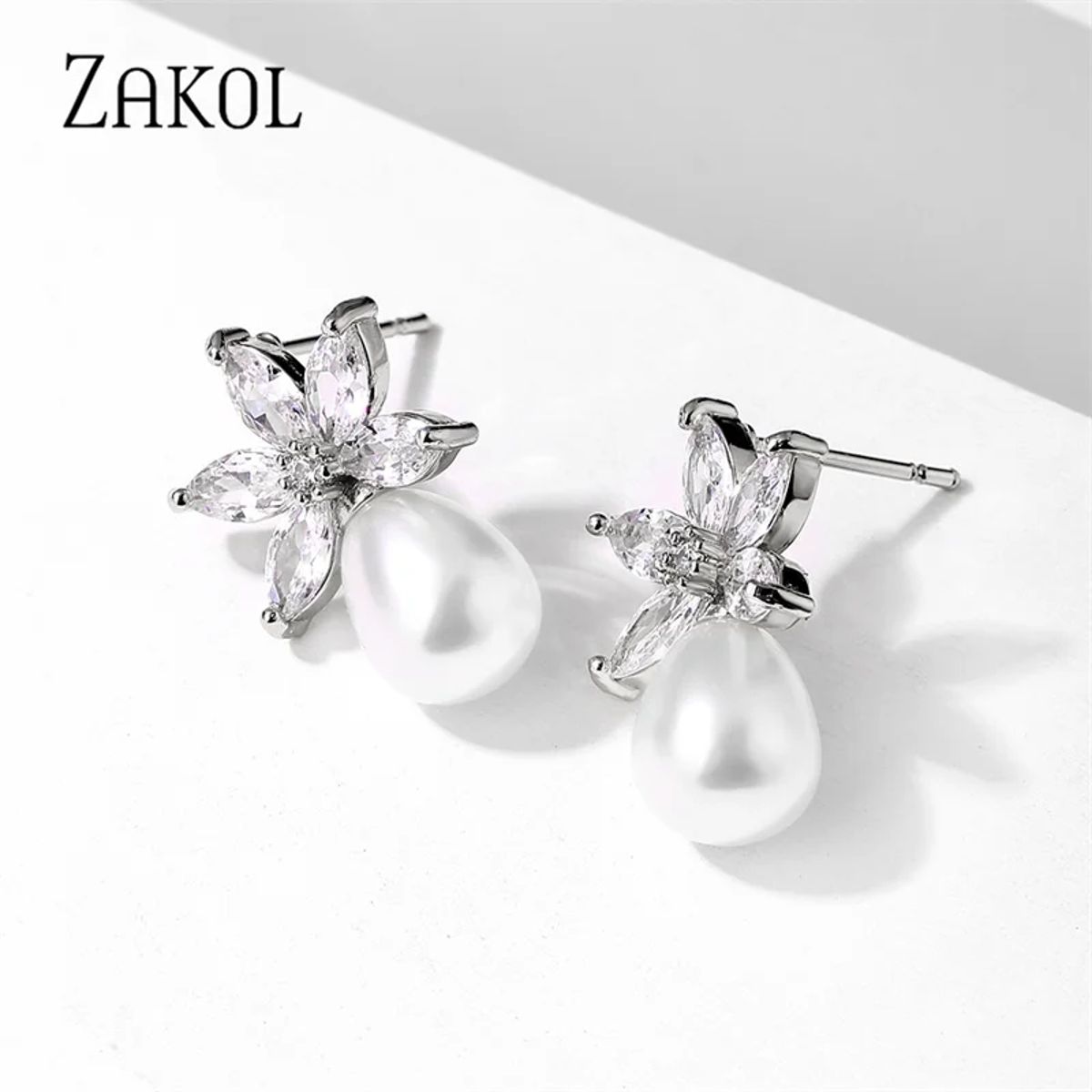 Elegant Leaf-Shaped Cubic Zirconia and Pearl Drop Earrings Elegant Leaf-Shaped Cubic Zirconia and Pearl Drop Earrings